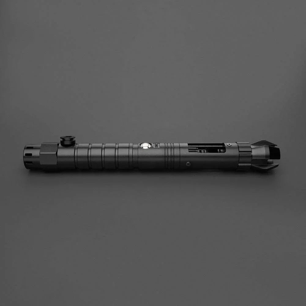 Black custom lightsaber hilt inspired by Darth Maul with detailed grip and emitter, on gray background.