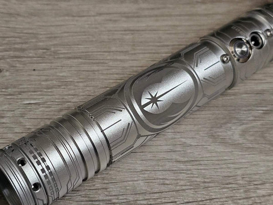 Custom lightsaber hilt with Jedi Order emblem, inspired by Luke Skywalker’s saber design.
