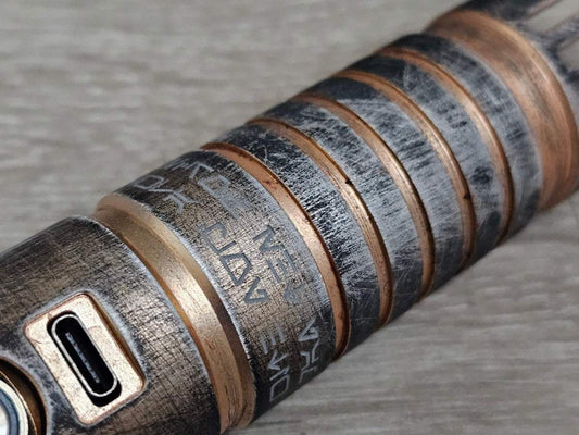 Weathered Obi-Wan Kenobi lightsaber hilt with acid etching and USB-C port