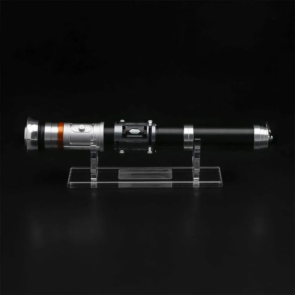 Obi-Wan Kenobi style lightsaber hilt with metal and black details on display stand