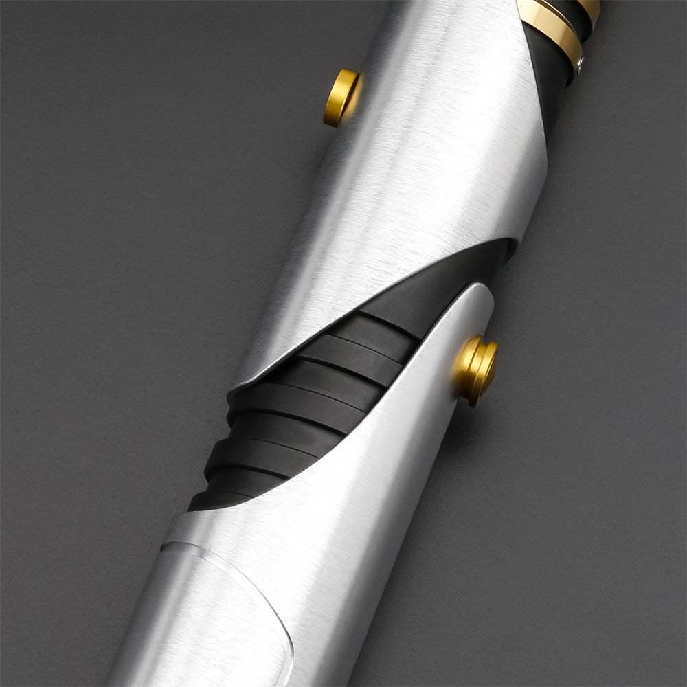 Close-up of Count Dooku lightsaber hilt with silver and black design and gold accents