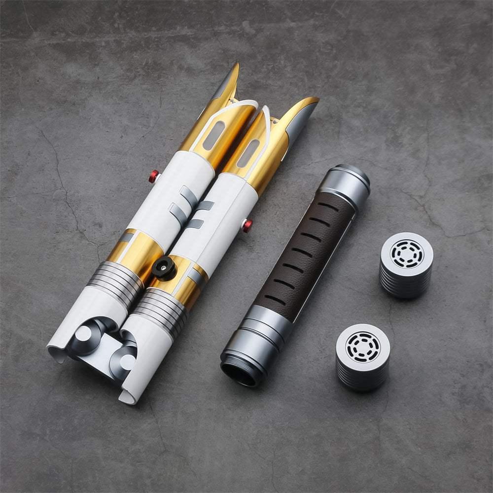 Custom lightsaber hilts inspired by Bastila Shan, gold and silver double-bladed saber parts on gray background