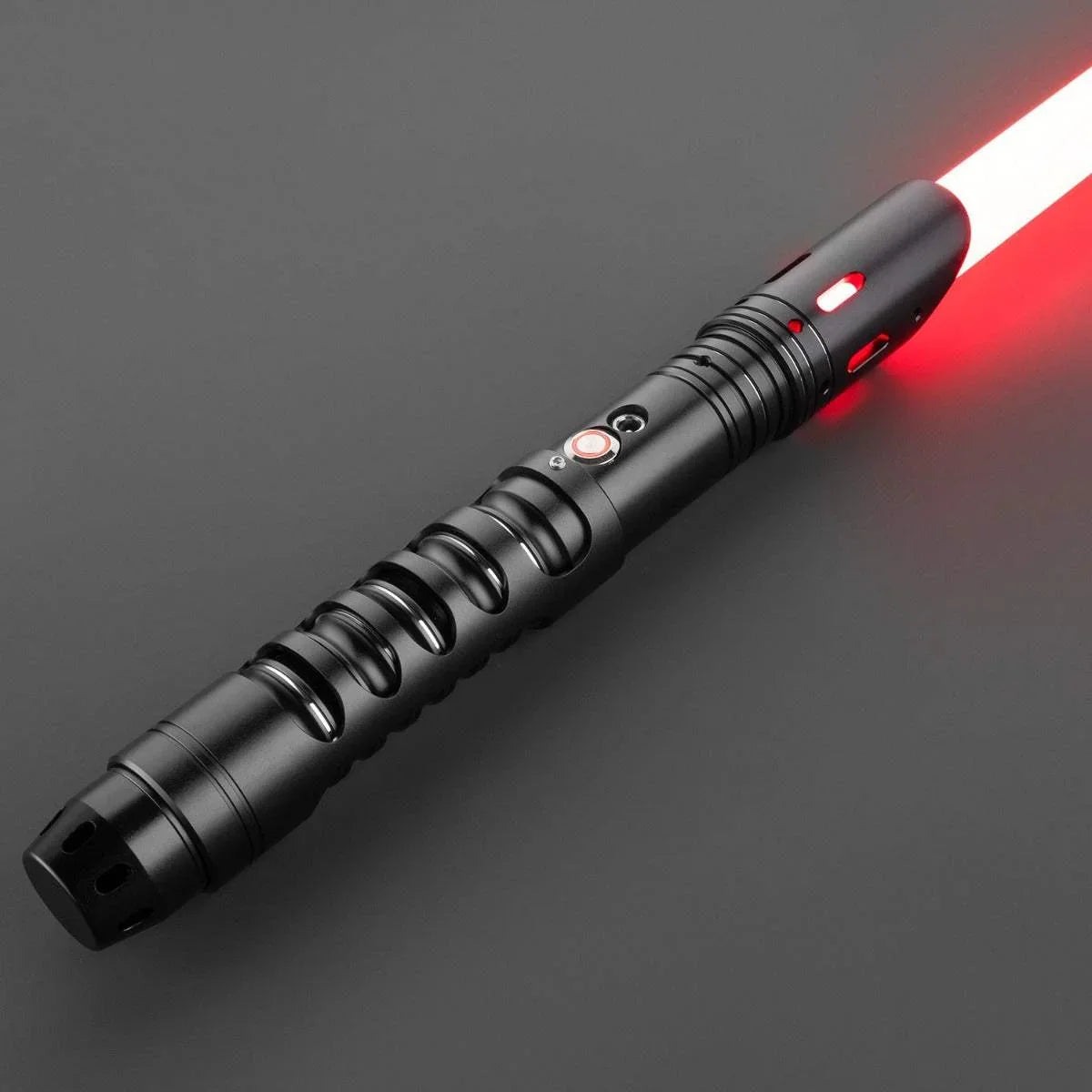 Black custom lightsaber with red blade inspired by Darth Vader, featuring grooved hilt design.